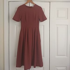 H&M Size 6 Rust midi dress with pockets.